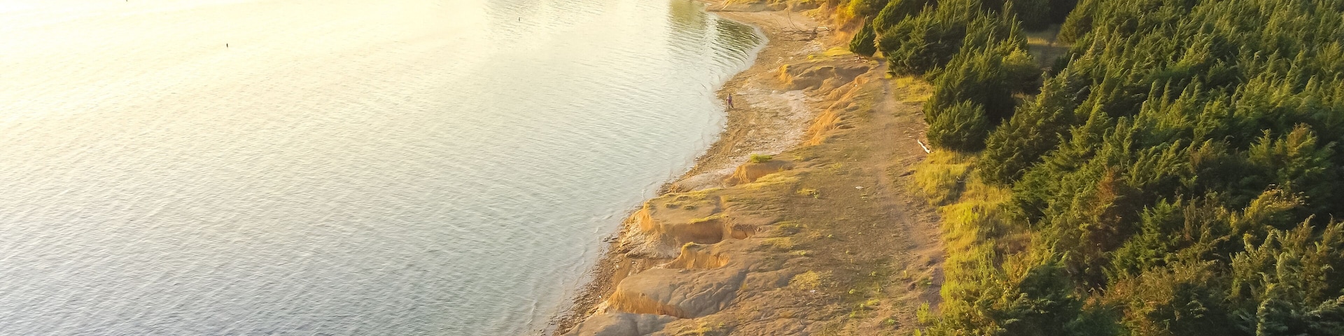 Top view people bank fishing along the sandy shore line at Ticky Creek Park, Lake Lavon, Texas, USA