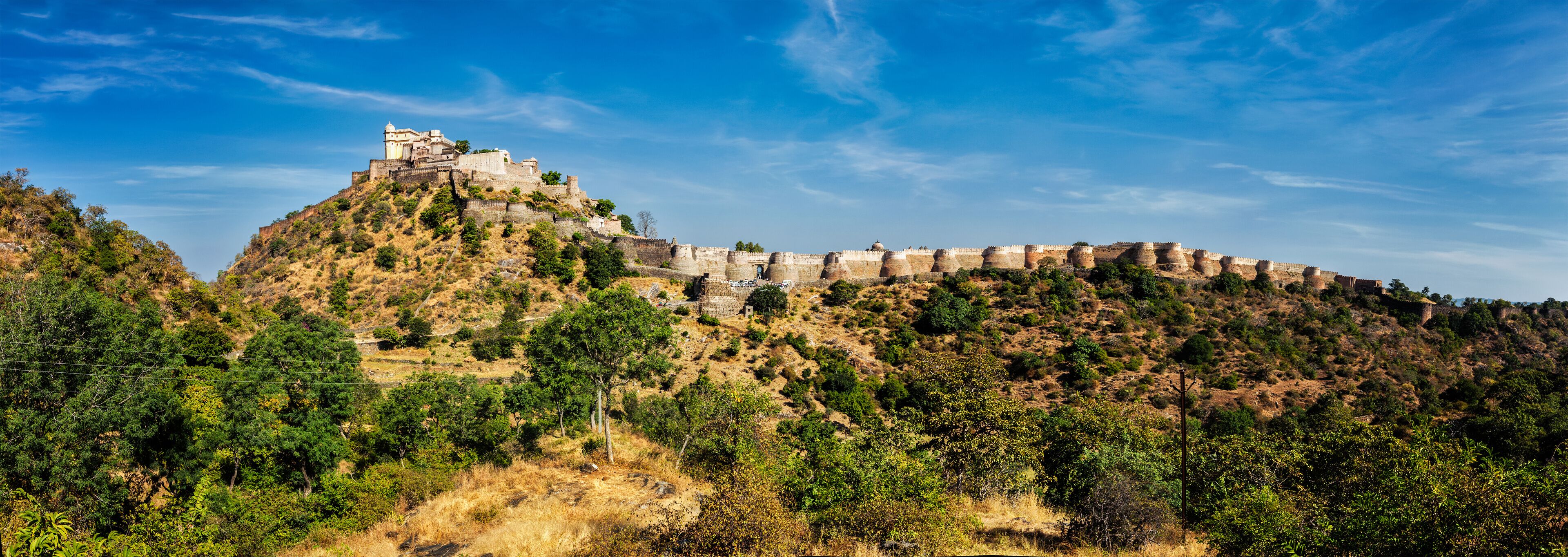 A historic fort on a hill with a clear sky.