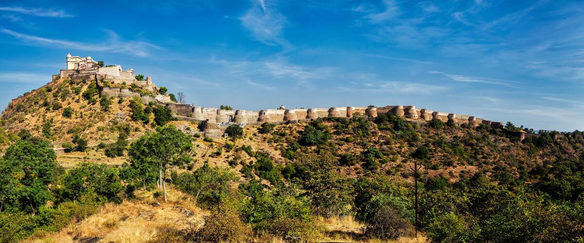 A historic fort on a hill with a clear sky.