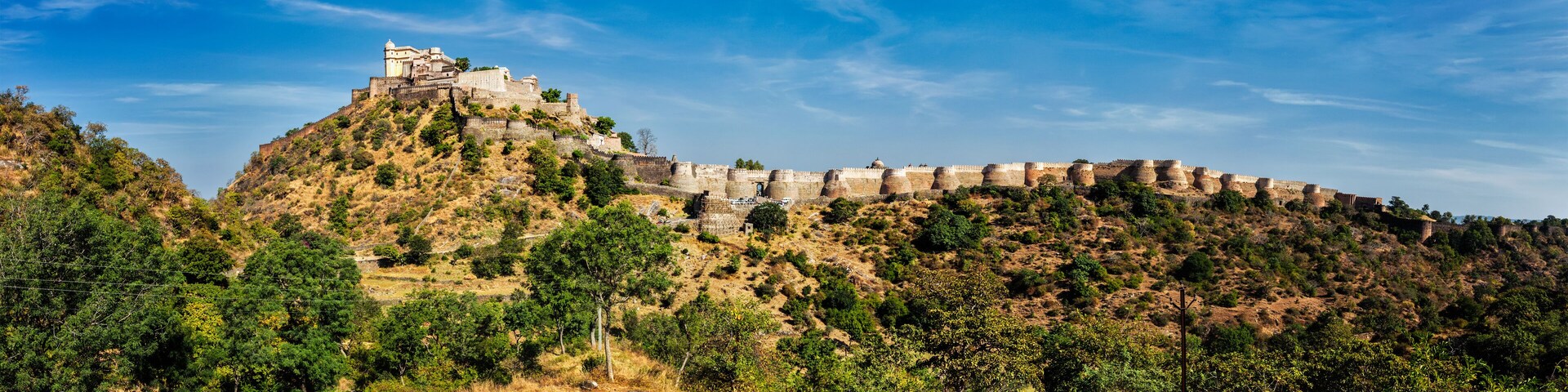 A historic fort on a hill with a clear sky.