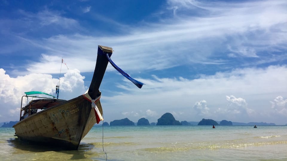 longboats of Tubkaek Beach. just waiting to take you to the Hong Islands in the distance.