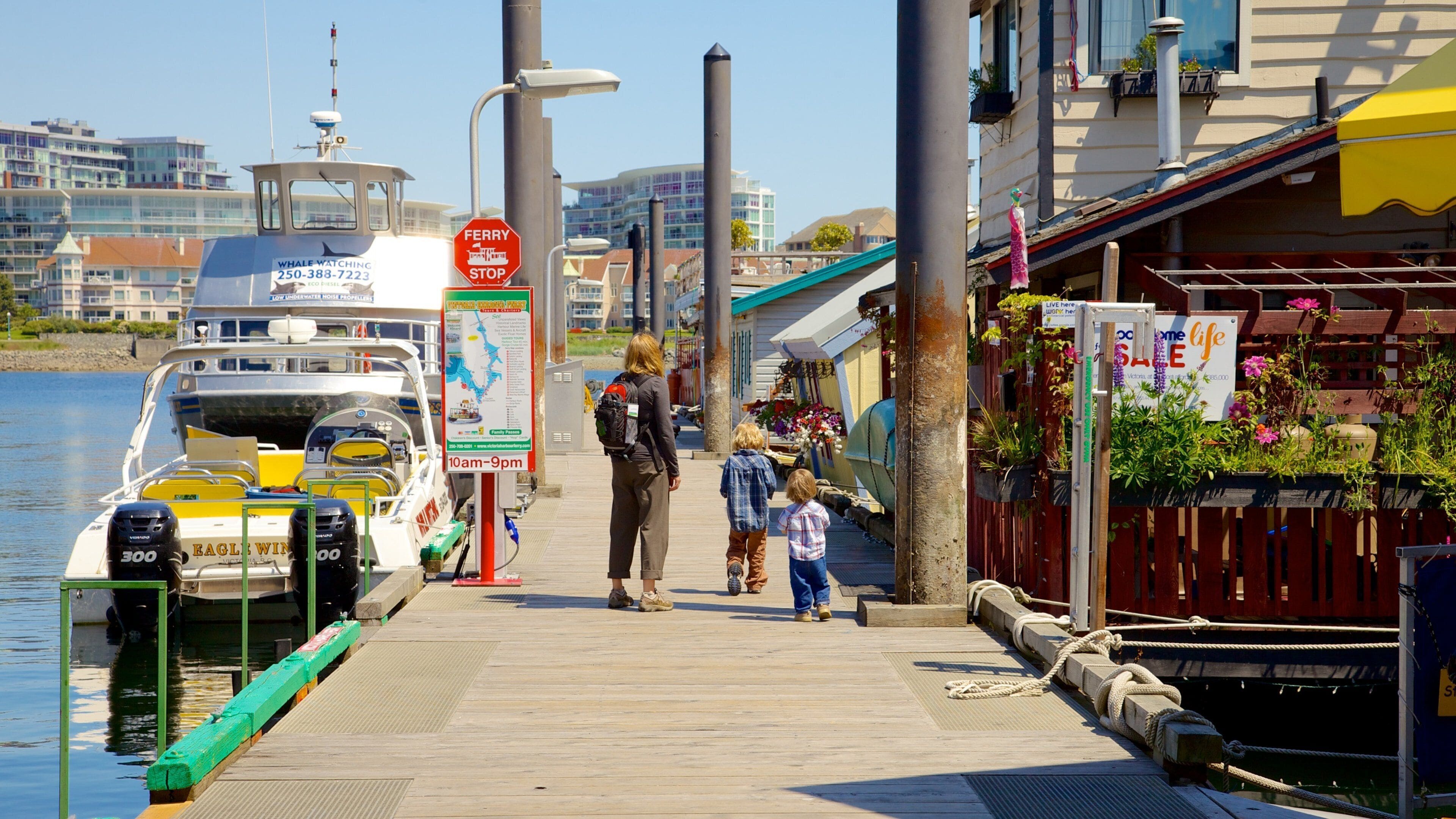 Victoria Fisherman\'s Wharf which includes a bay or harbor and a coastal town as well as a family