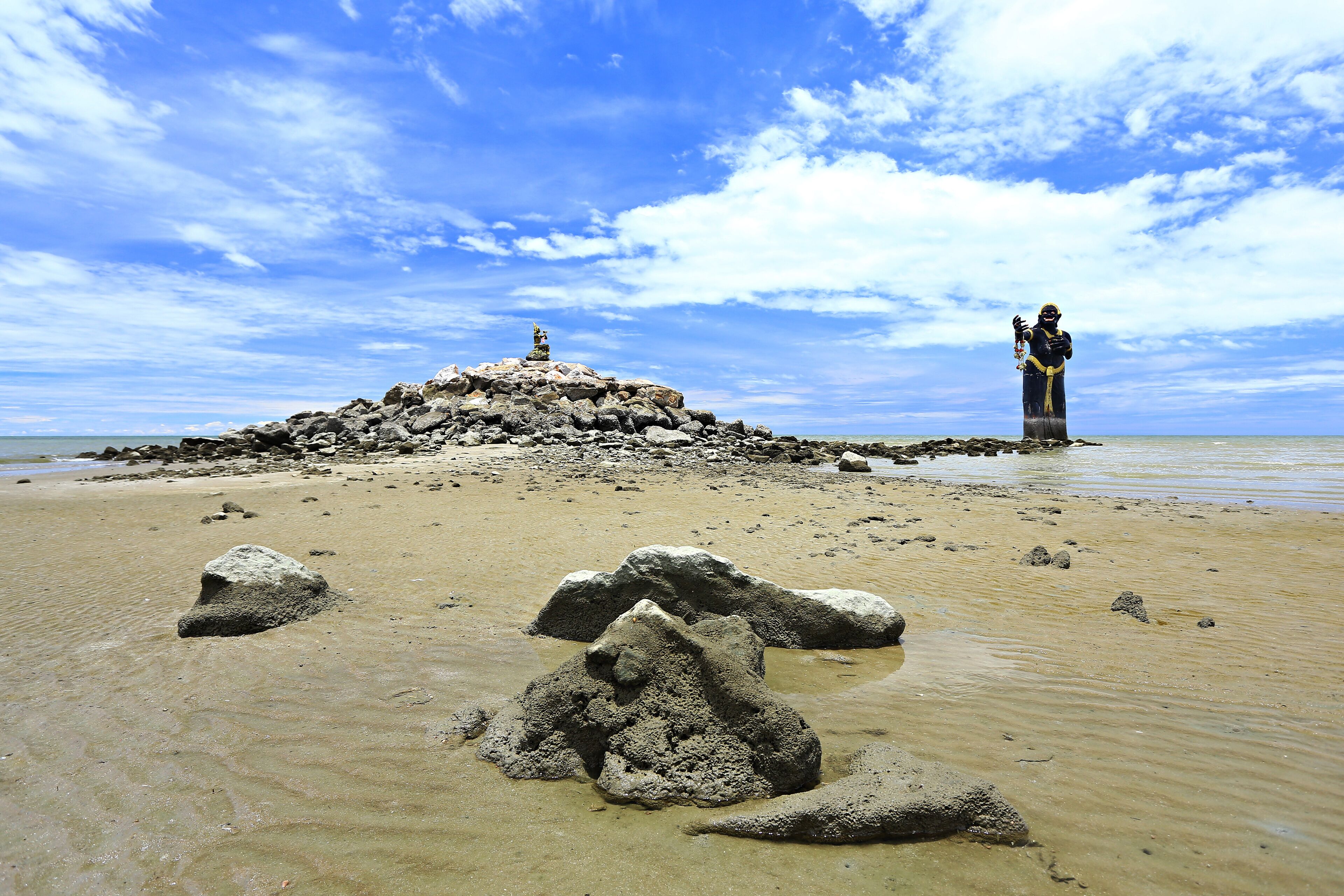 Scary giant black statue in the sea Puek Tian beach Phetchaburi, Thailand 