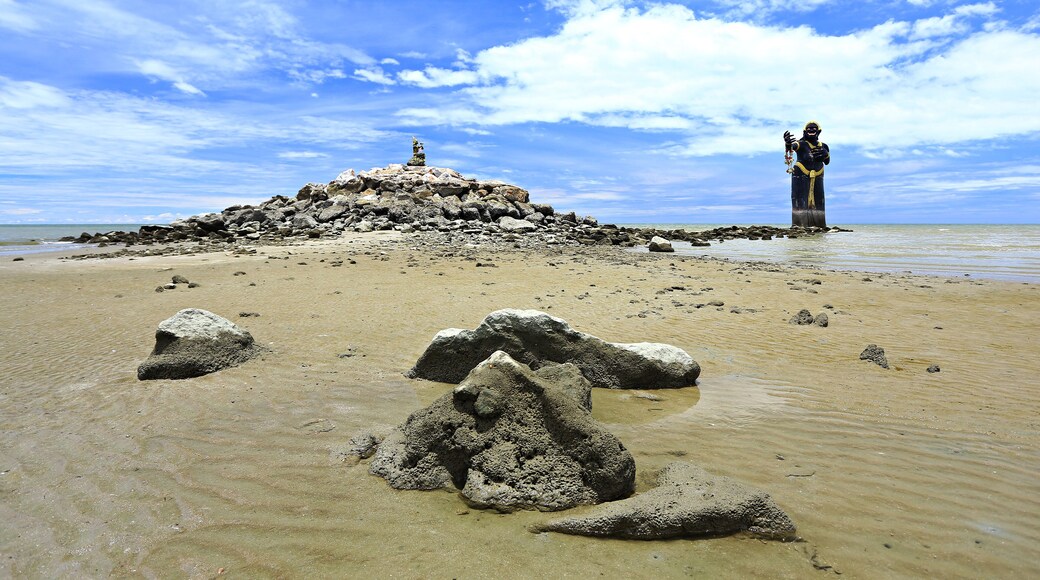 Scary giant black statue in the sea Puek Tian beach Phetchaburi, Thailand