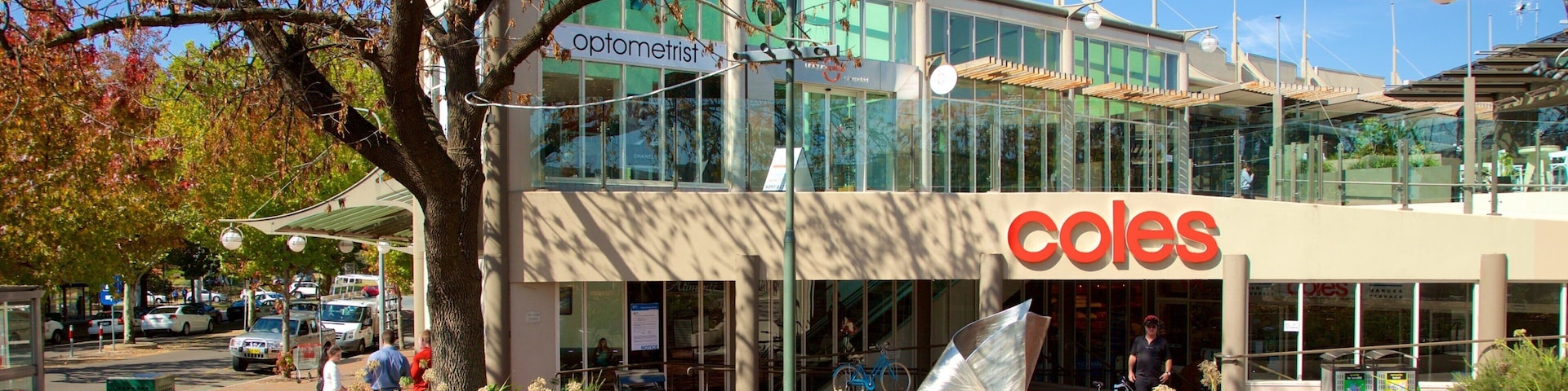 Manuka Shopping Centre which includes autumn leaves and signage