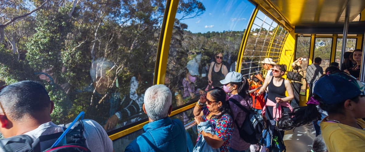 Katoomba Scenic World which includes interior views and a gondola as well as a small group of people