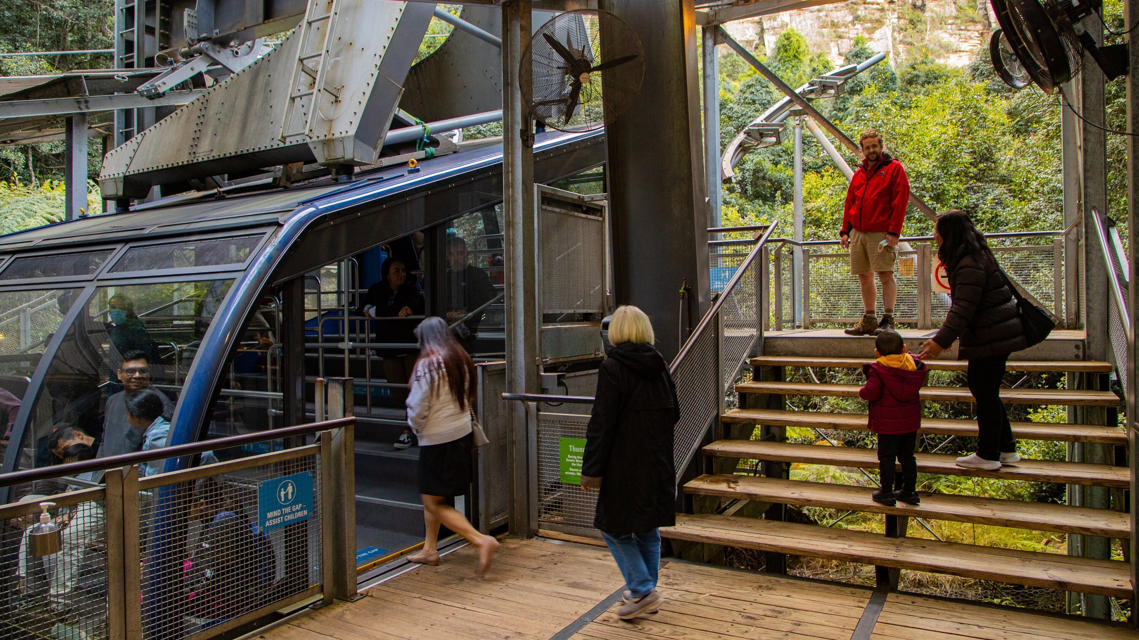 Katoomba Scenic World which includes a gondola as well as a small group of people