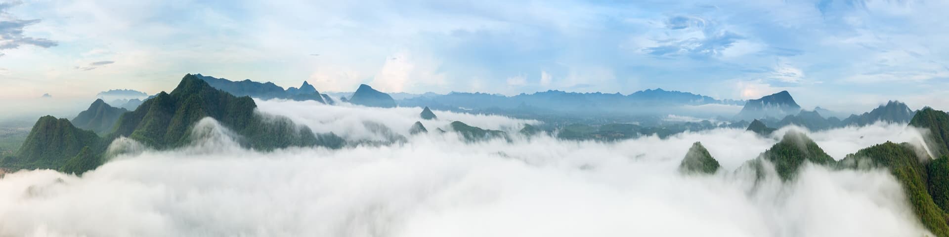 Beautiful aerial view sea of fog in the morning forest mountent with green mountains. Nong Ya Plong, Phetchaburi, Thailand