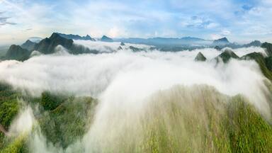 Beautiful aerial view sea of fog in the morning forest mountent with green mountains. Nong Ya Plong, Phetchaburi, Thailand