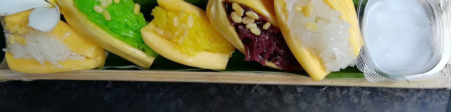 Jackfruit stuffed with glutinous rice sided with coconut milk served in a bamboo tube. This is a traditional and unique dessert in Thailand. This floating market has many local food. There are a lot of seats near the water, so you can enjoy the view of waterfall while eating. #GoodEats