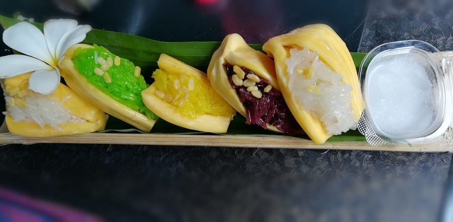 Jackfruit stuffed with glutinous rice sided with coconut milk served in a bamboo tube. This is a traditional and unique dessert in Thailand. This floating market has many local food. There are a lot of seats near the water, so you can enjoy the view of waterfall while eating. #GoodEats