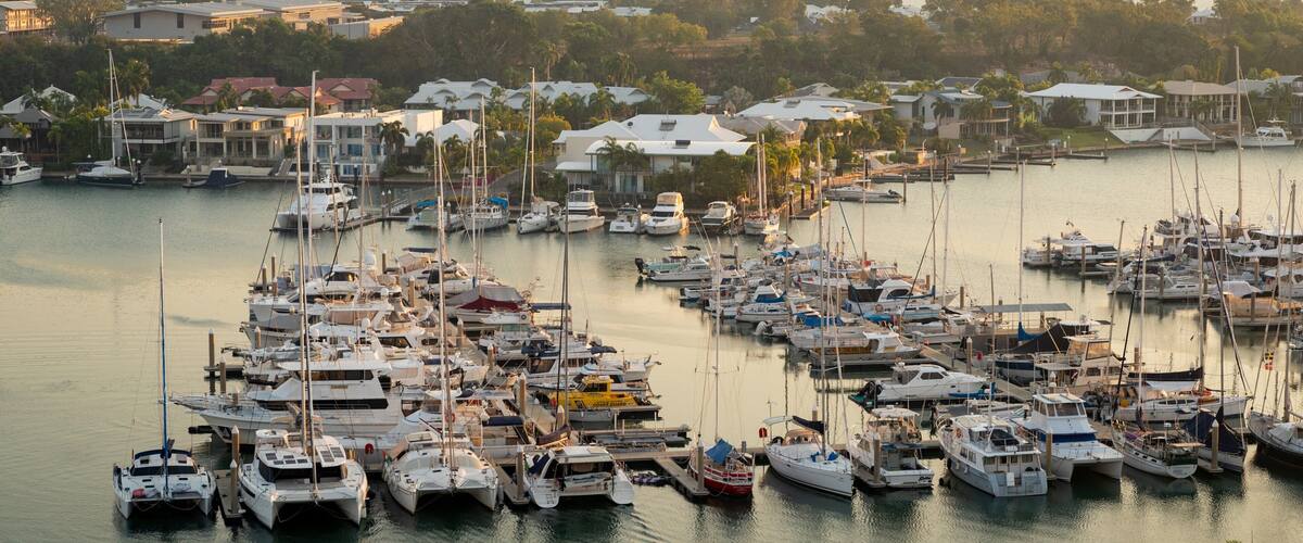 Cullen Bay Marina featuring landscape views, a sunset and a bay or harbor