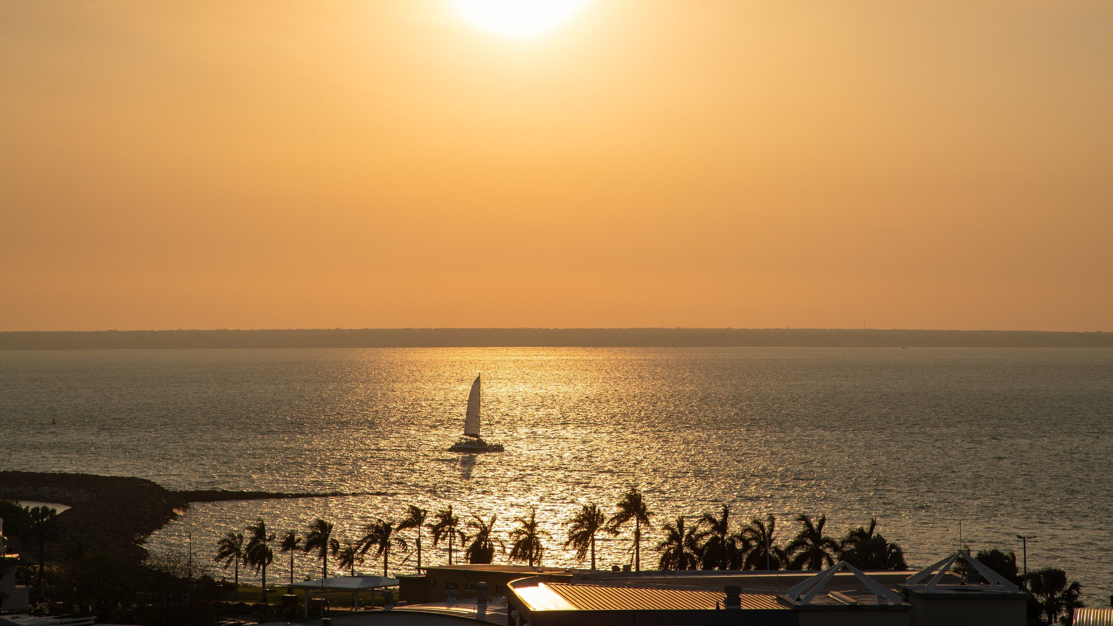 Cullen Bay Marina showing sailing, a sunset and general coastal views