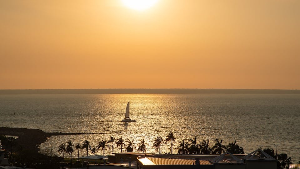Cullen Bay Marina showing sailing, a sunset and general coastal views
