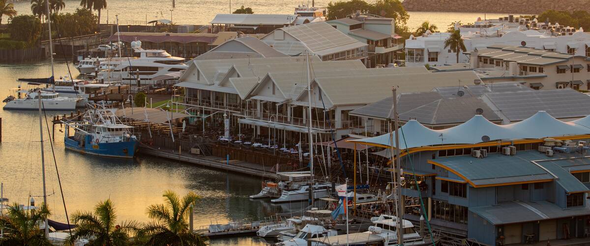Cullen Bay Marina featuring a bay or harbor, a sunset and landscape views