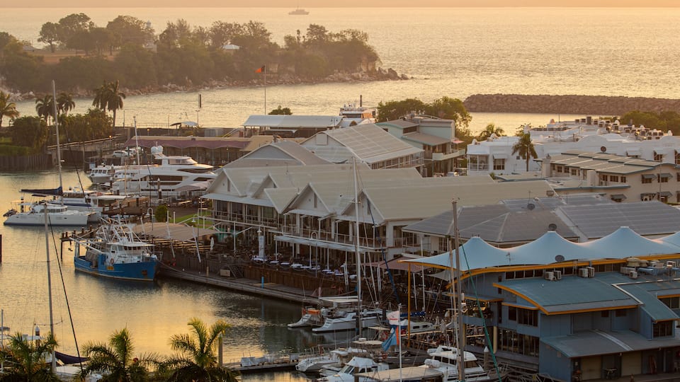 Cullen Bay Marina featuring a bay or harbor, a sunset and landscape views
