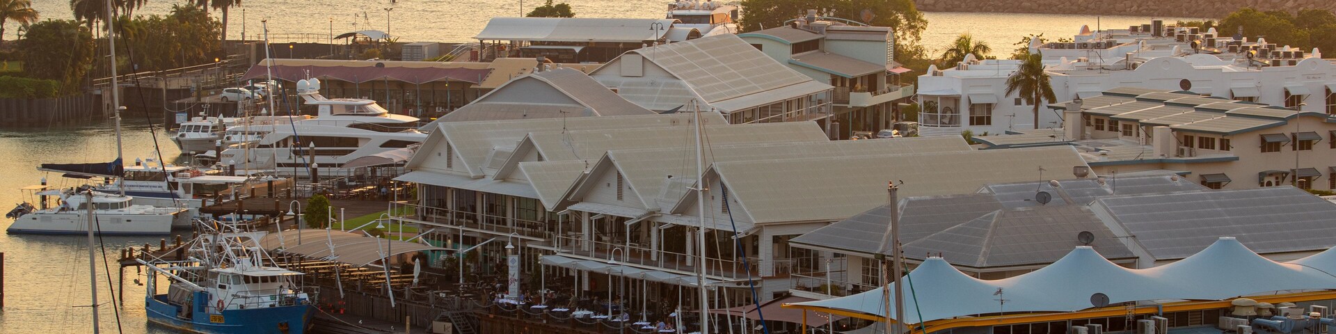 Cullen Bay Marina featuring a bay or harbor, a sunset and landscape views