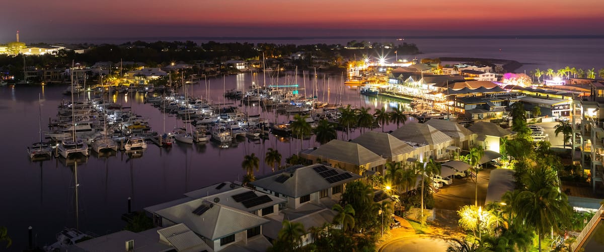 Cullen Bay Marina which includes a coastal town, a bay or harbor and night scenes