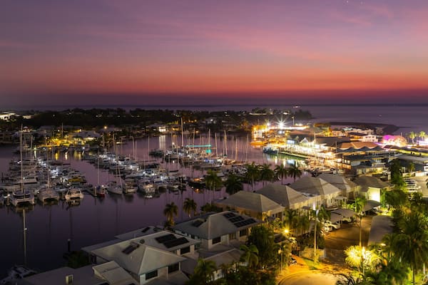 Cullen Bay Marina which includes a coastal town, a bay or harbor and night scenes