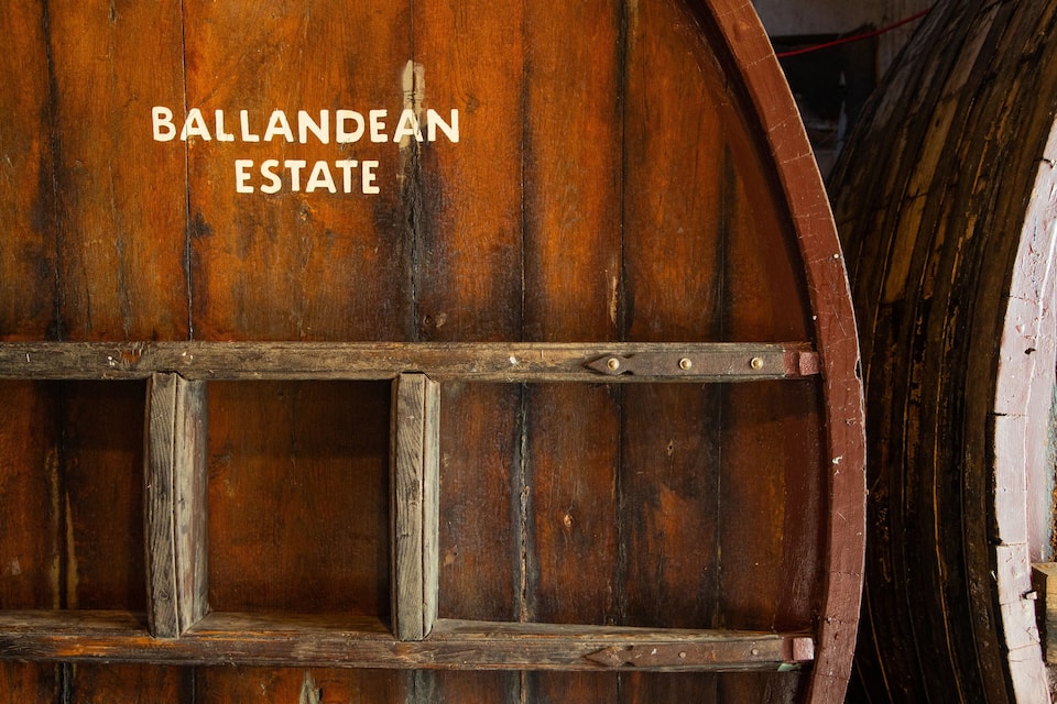 A wooden door with the inscription "BALLANDEAN ESTATE".