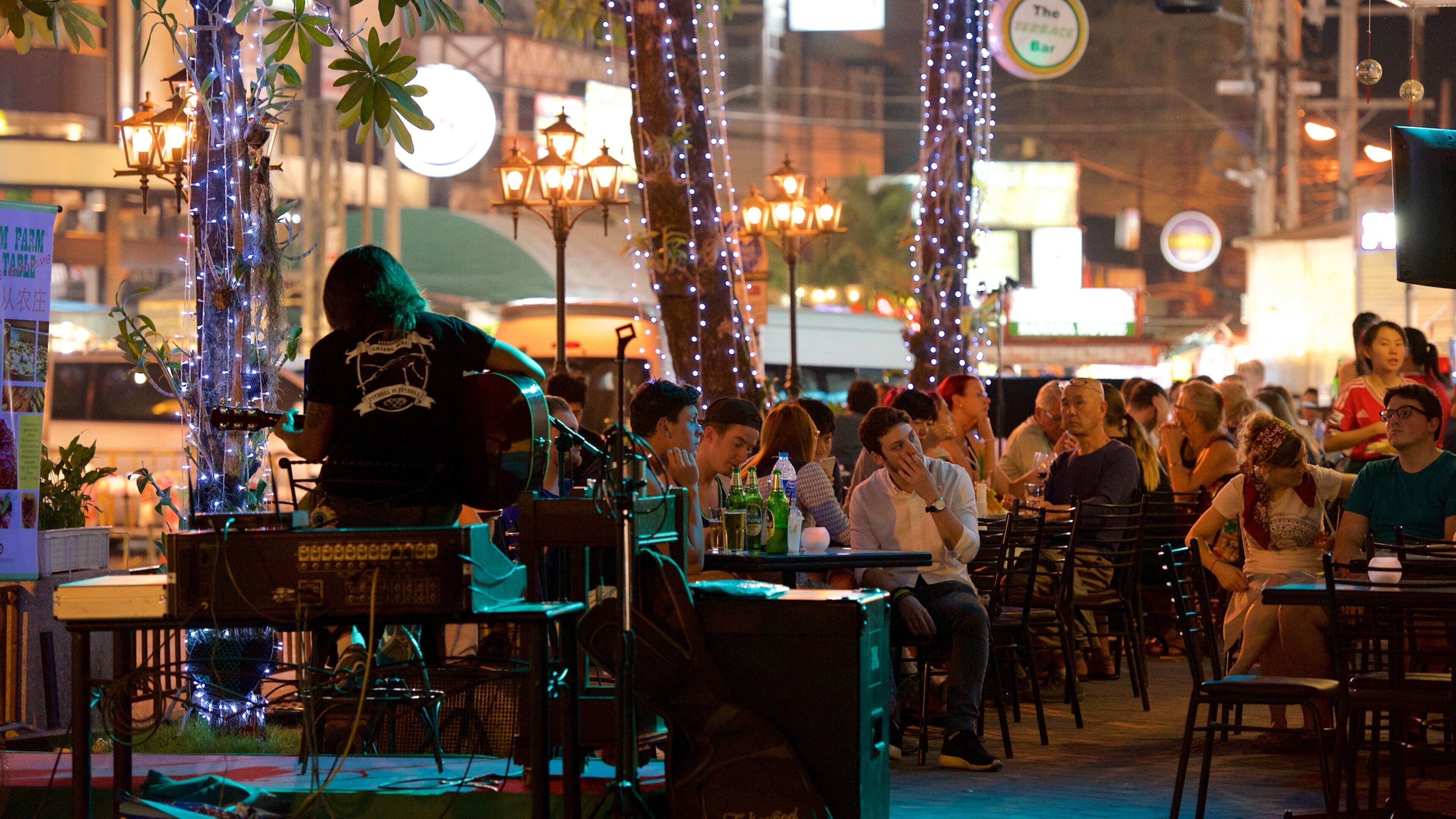 Chang Khlan featuring performance art, street scenes and outdoor eating