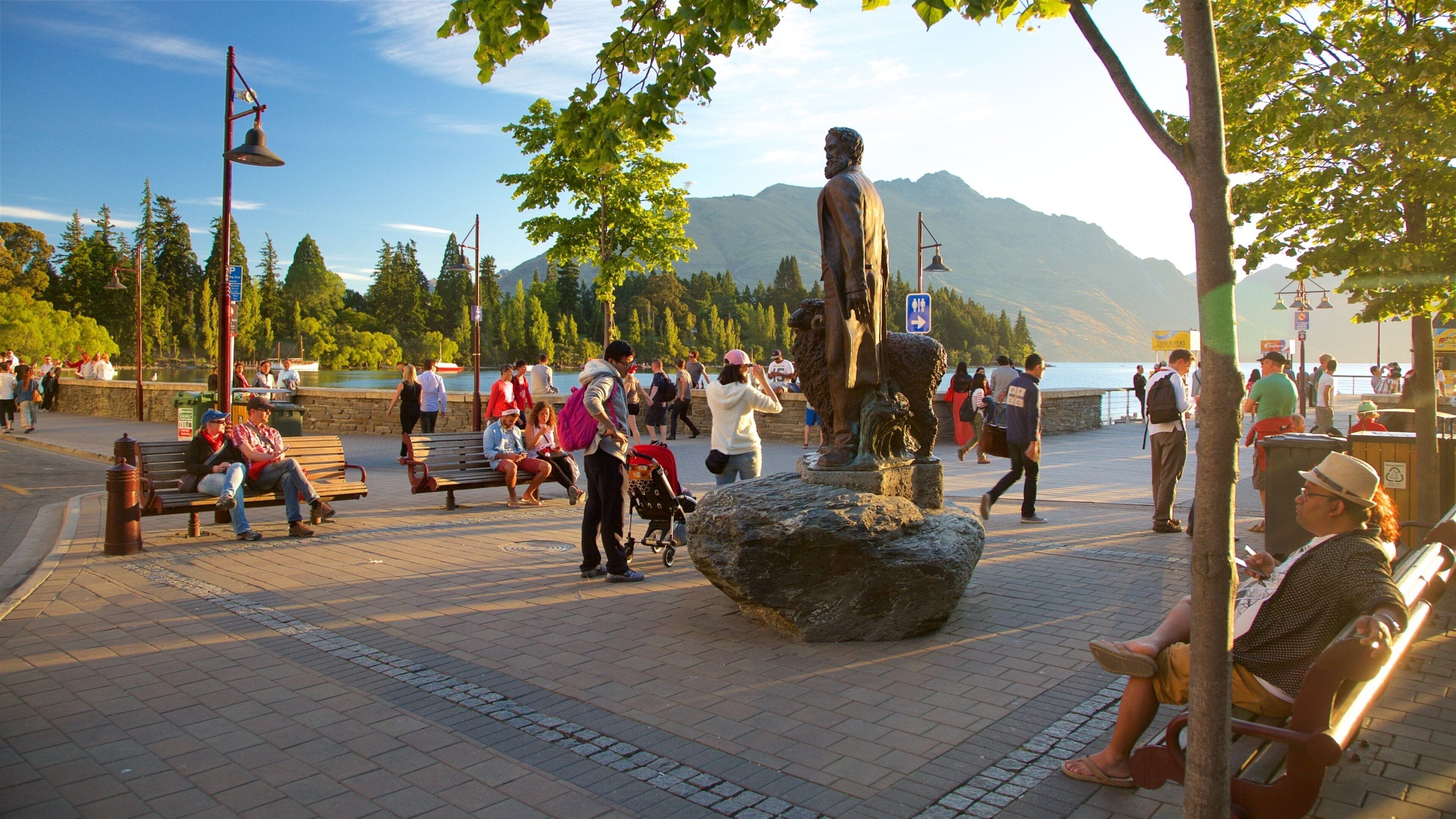 Queenstown City Centre showing street scenes, a sunset and a statue or sculpture