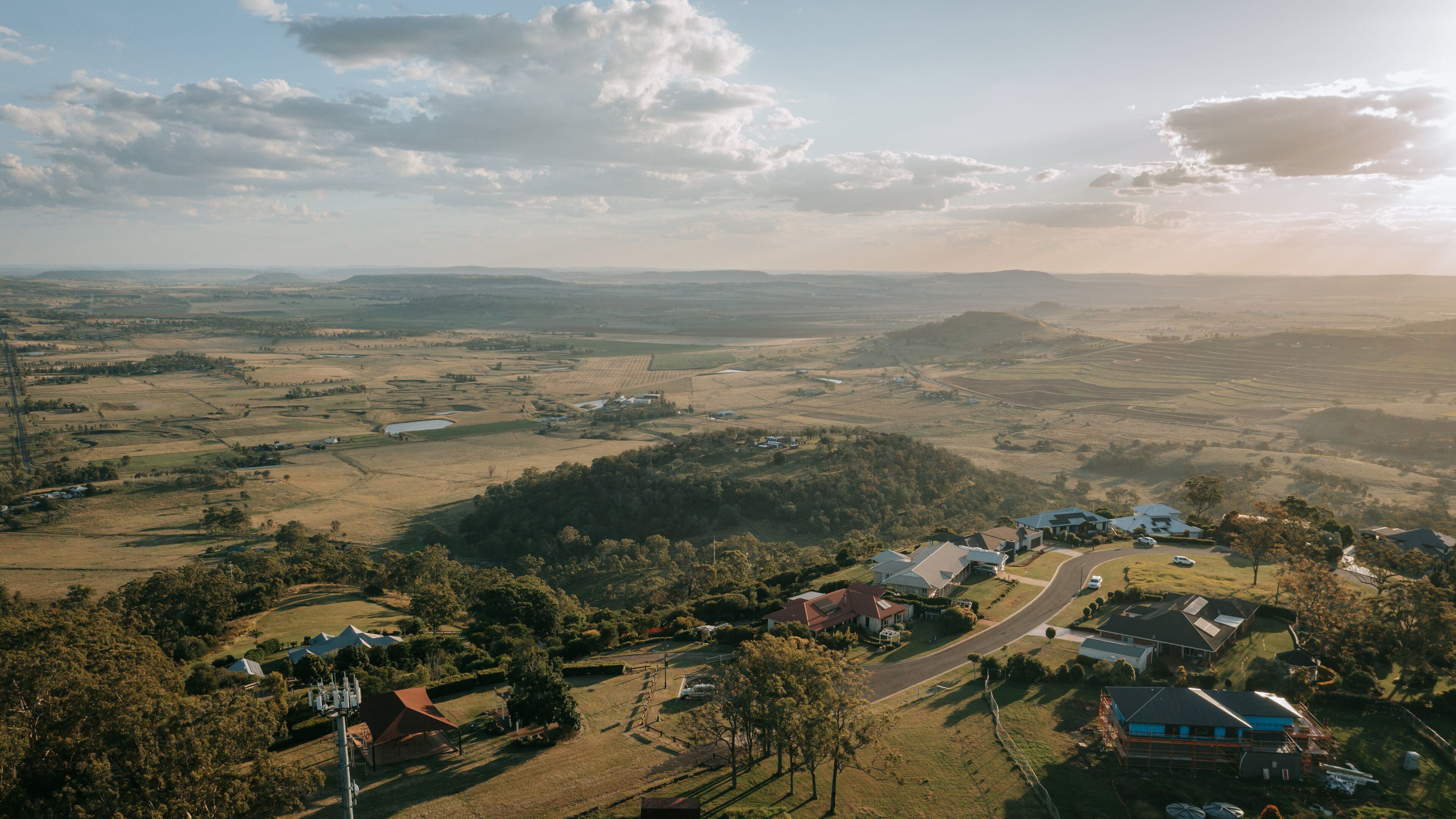 Preston featuring landscape views, a small town or village and a sunset