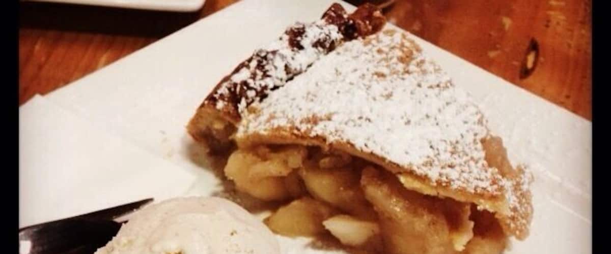 Homemade apple pie with spiced cider ice-cream. Sutton's Cider Factory is just off the highway outside of Stanthorpe with pies, preserves, cider and juice all made from the apple orchard out the back.
