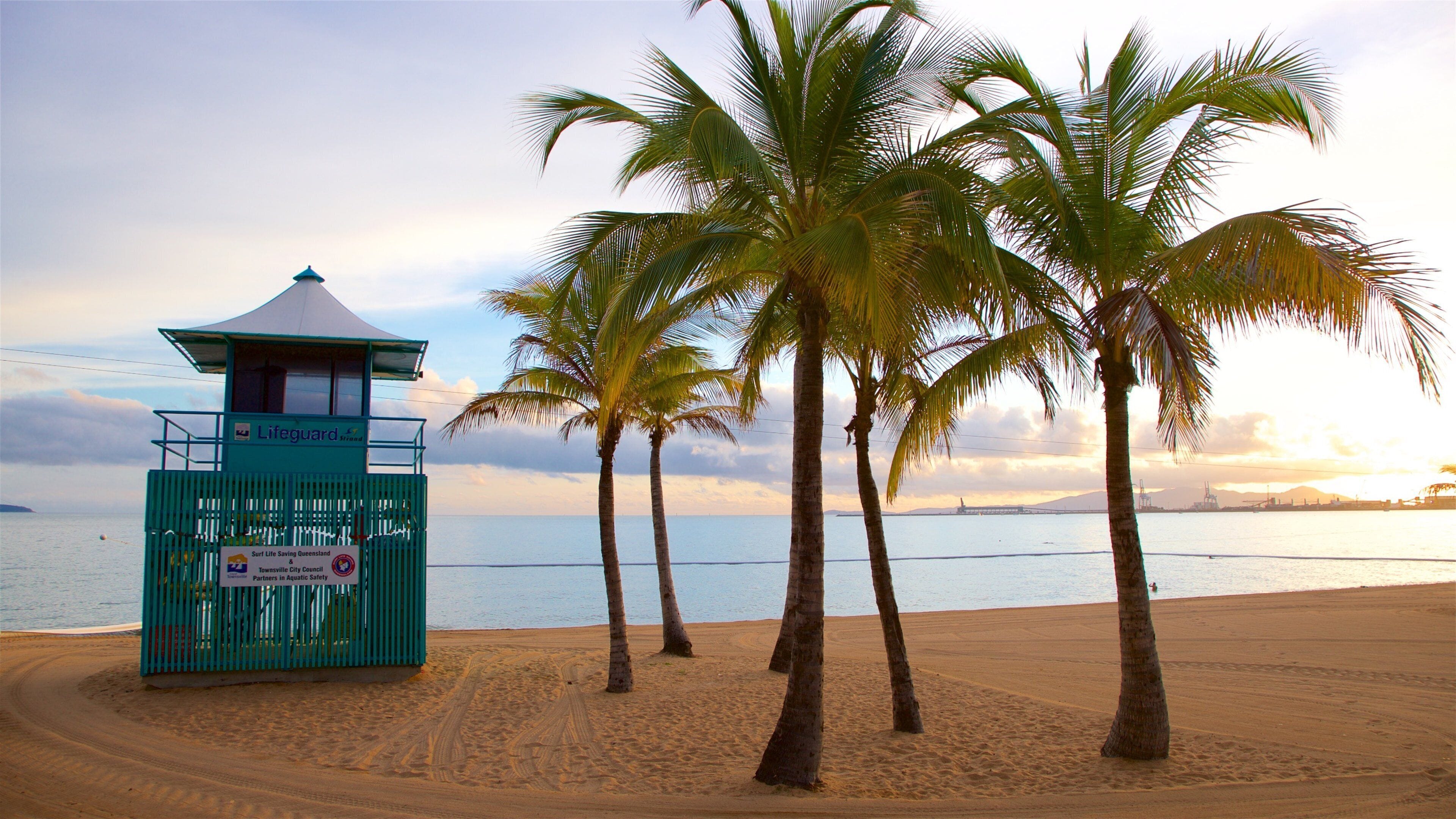 The Strand showing a sunset, a beach and general coastal views