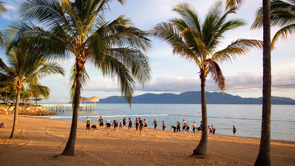 The Strand featuring a sandy beach, general coastal views and a sunset