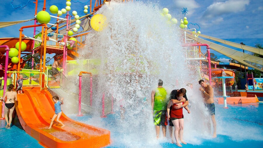 WhiteWater World featuring a pool and a waterpark as well as a small group of people