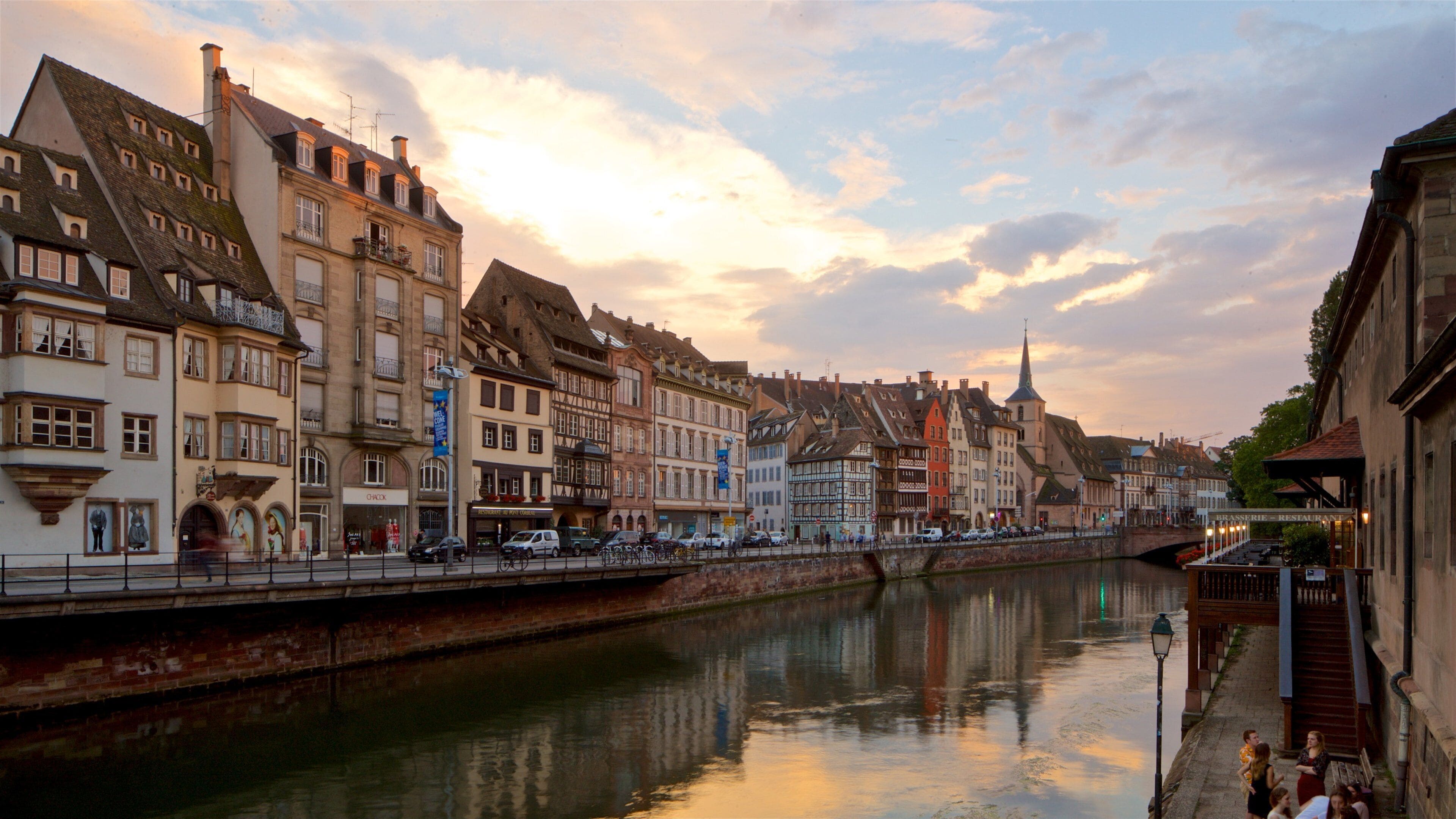 Strasbourg showing a river or creek, a sunset and a city