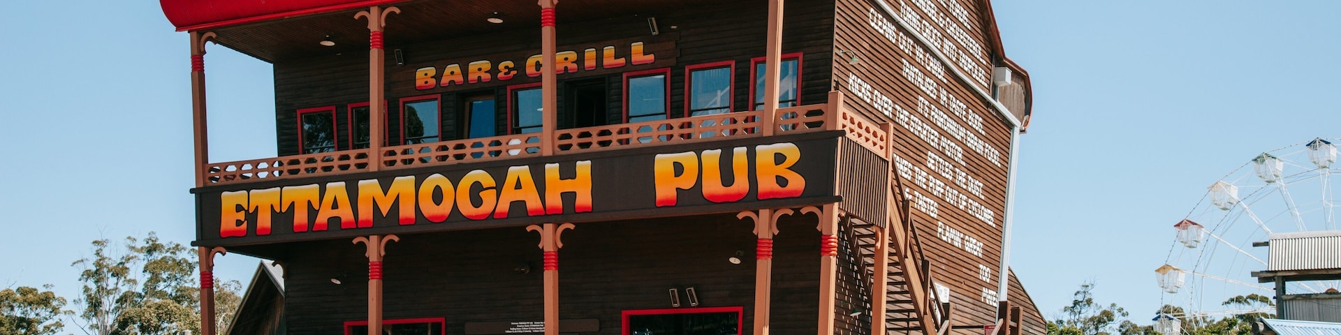 Aussie World featuring signage and a bar