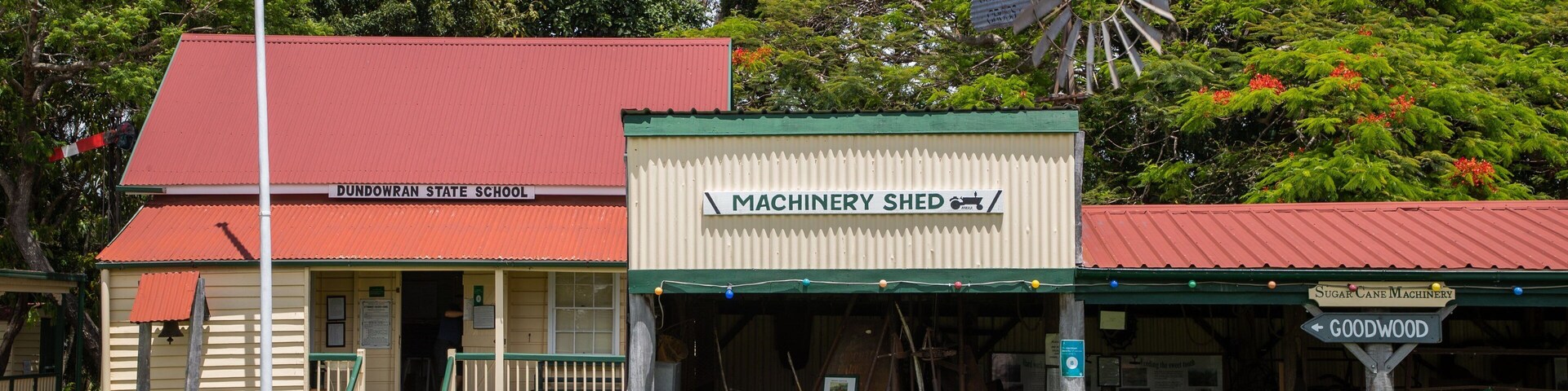 Hervey Bay Historical Village Museum showing a small town or village and signage