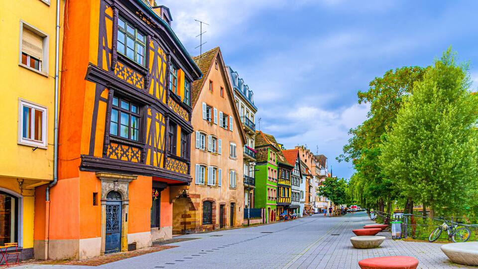 Medieval buildings old colorful houses on Quai des Bateliers embankment in old town Strasbourg city historic Centre Ville Krutenau quarter, Alsace Grand Est region, France