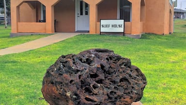 The old Minnie R. Slief Library, now in the City Park, Cheyenne, Oklahoma. The big rock in front is a 1,510 pound fossilized termite nest, at least 4 million years old.