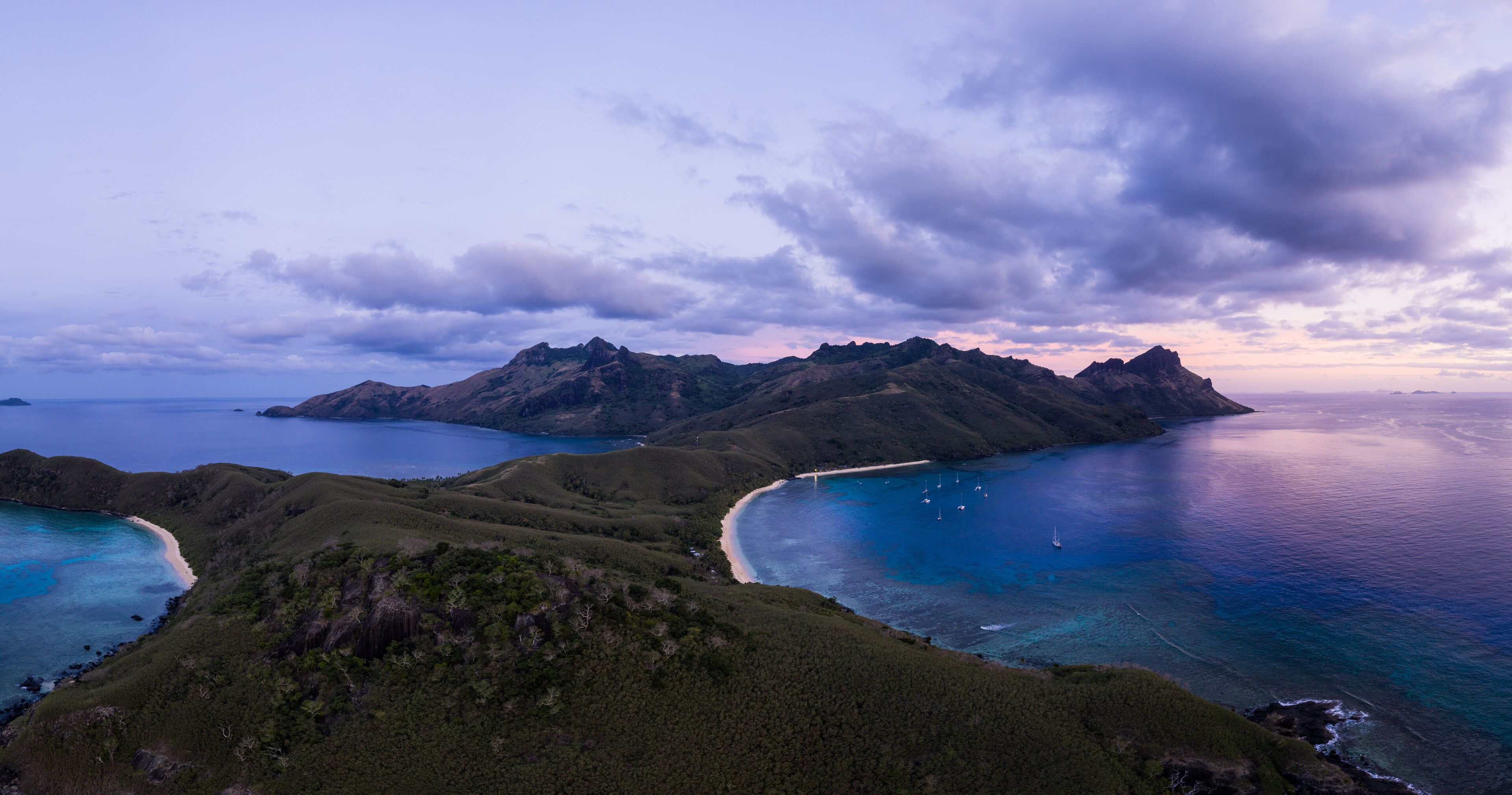 Dramatic aerial panorama of the sunset over the Waya island in the Yasawa group in Fiji