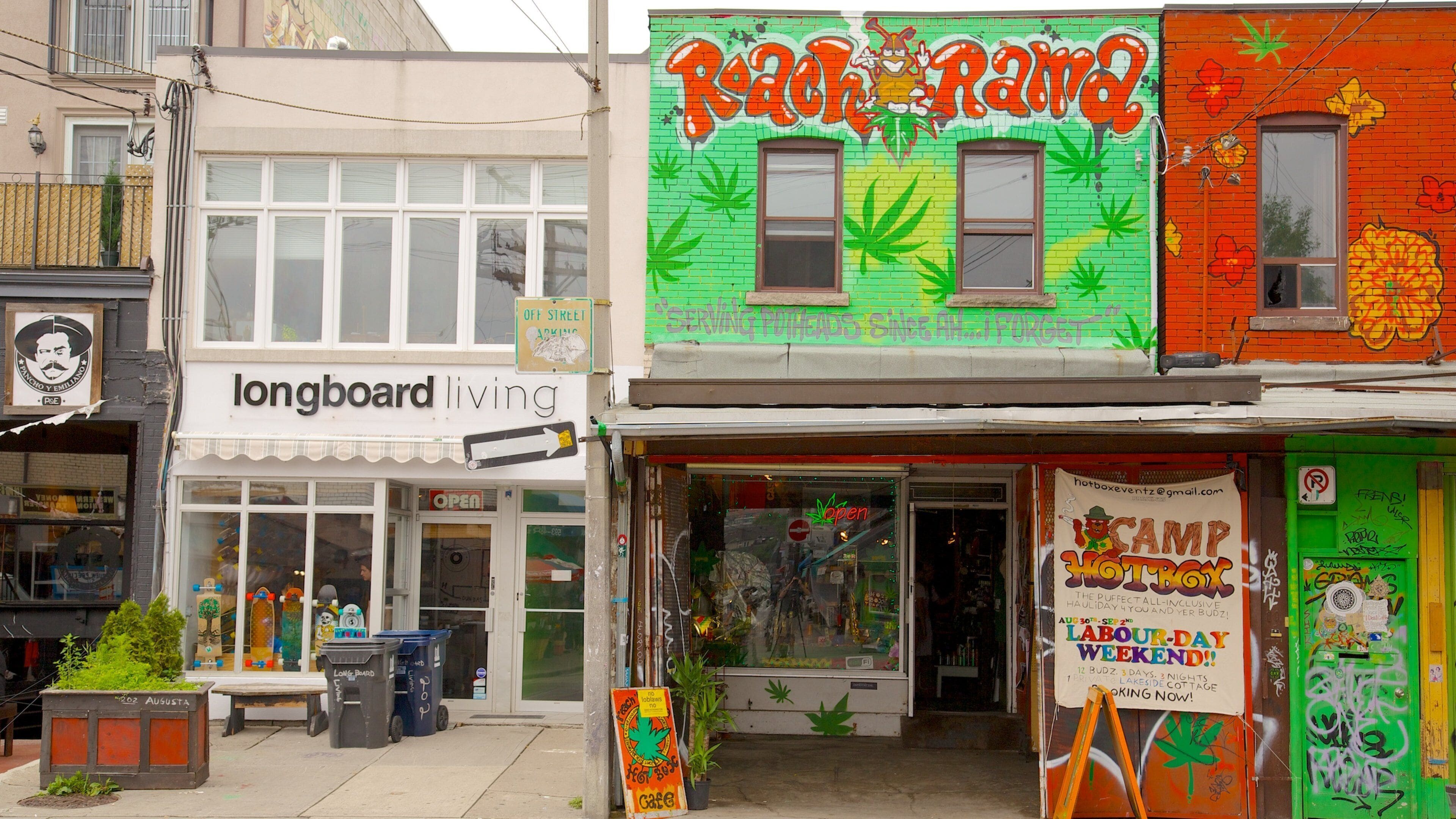 A storefront with a colorful mural and a sign that reads "Rama."