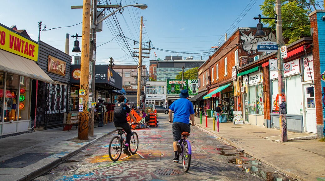 Kensington Market featuring street scenes and cycling as well as a couple