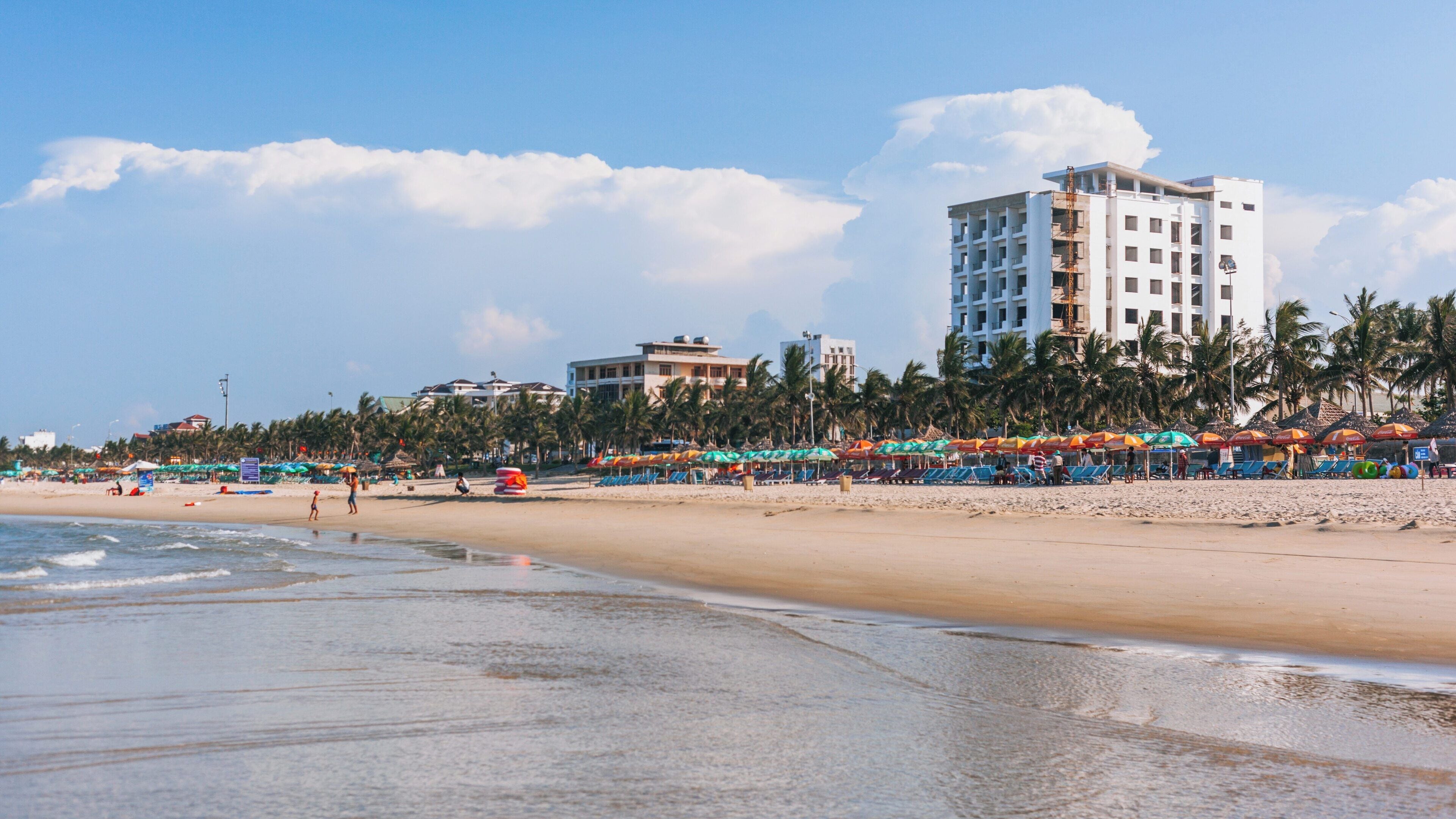 Enjoying the vibrant atmosphere and stunning views at My Khe Beach in Da Nang, Vietnam during a sunny day