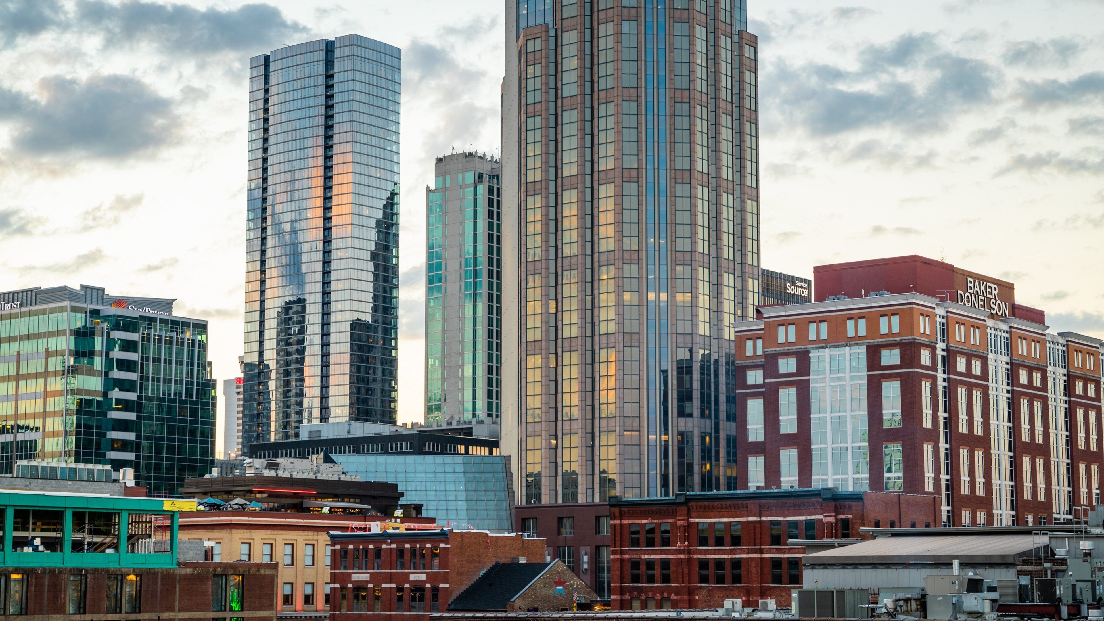 The District which includes a sunset, a skyscraper and a city