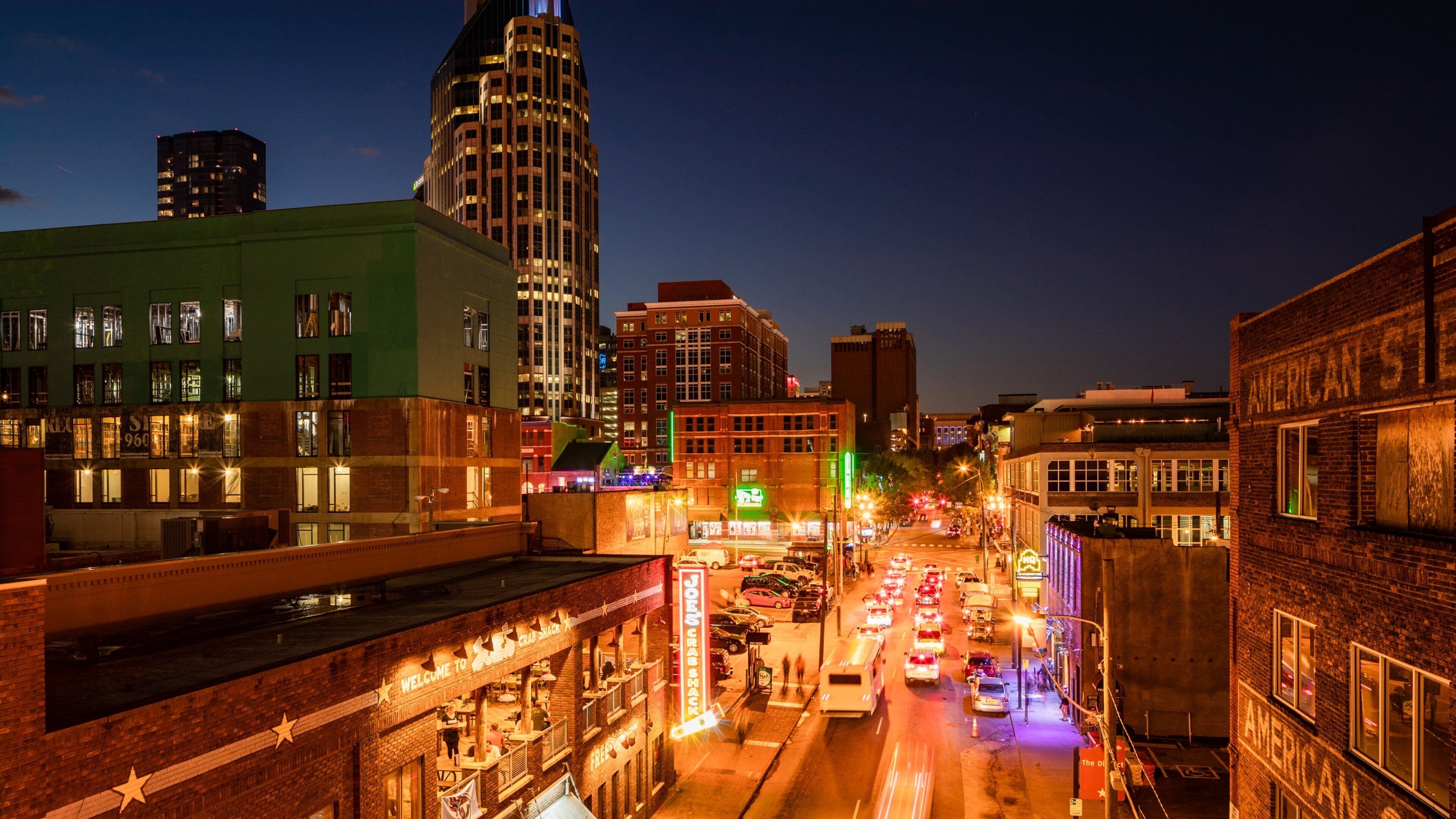 The District featuring a city and night scenes