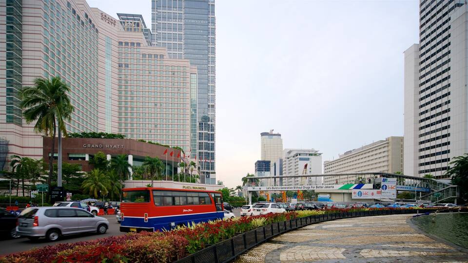 Jakarta showing a square or plaza, flowers and a city