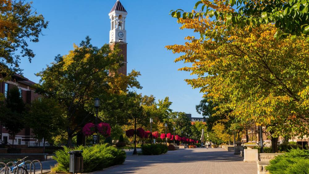Bell tower surrounded by colorful autumn trees in West Lafayette Campus, Indiana