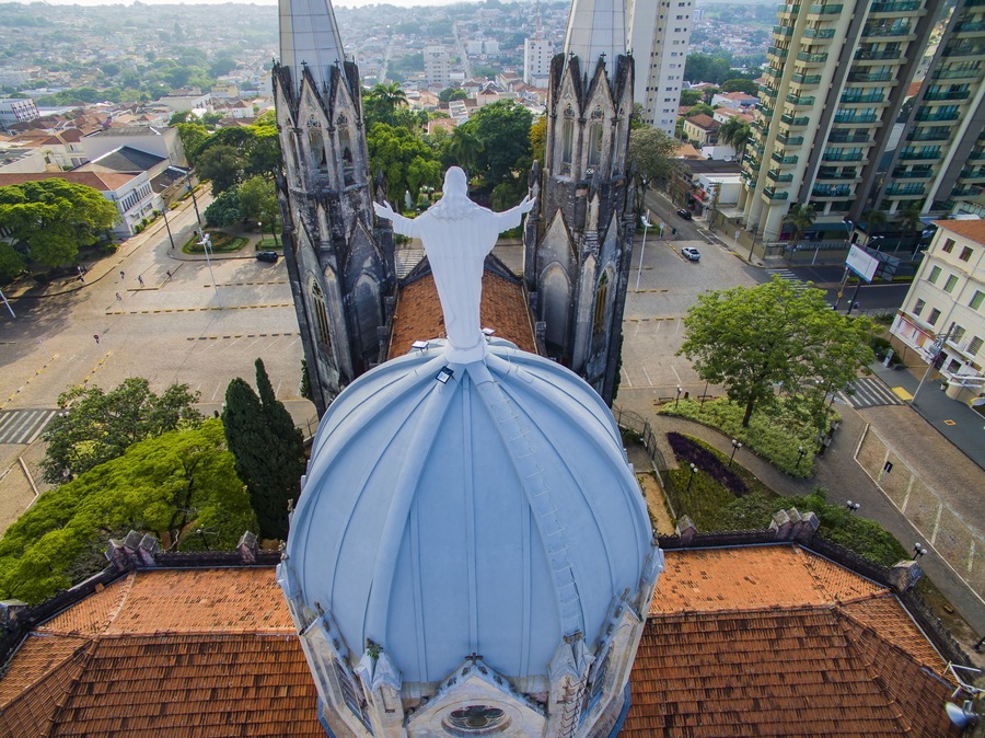 Statue of Jesus Christ on top of the Catholic Church, Cathedral of Sant'Ana, City of Botucatu, Sao Paulo State Brazil South America. Metropolitan Cathedral of Botucatu has Gothic style.