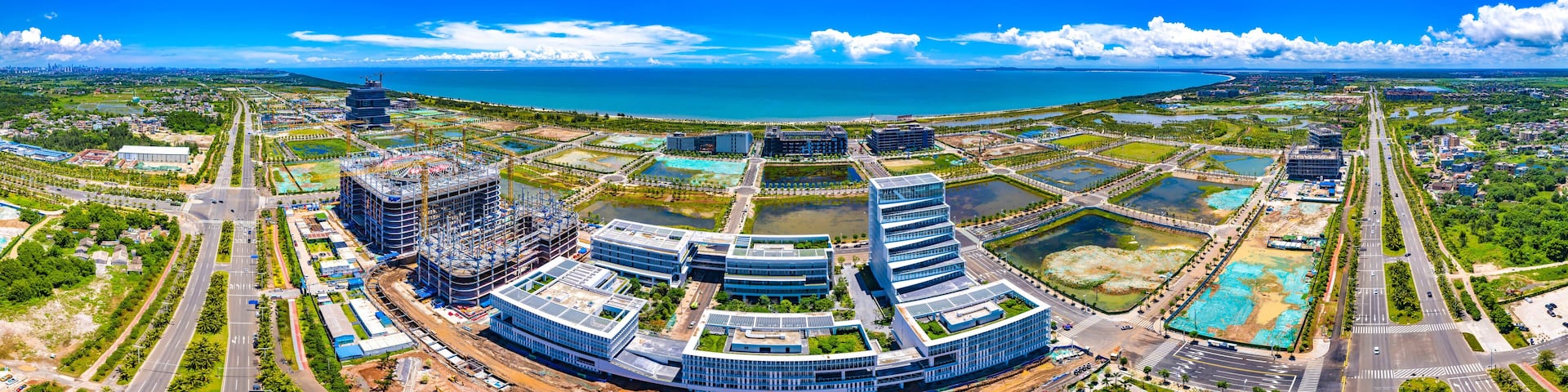Aerial Panorama of Haikou Jiangdong New District, an International Hub for Retail, Residential, Leisure, Workplace, and Transportation in Hainan Free Trade Zone.