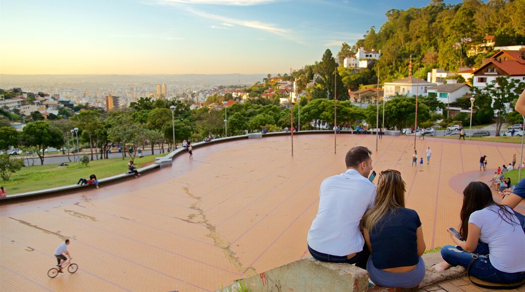 Pope\'s Square featuring a square or plaza and a sunset as well as a small group of people