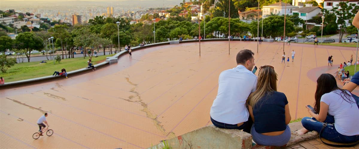 Pope\'s Square featuring a square or plaza and a sunset as well as a small group of people