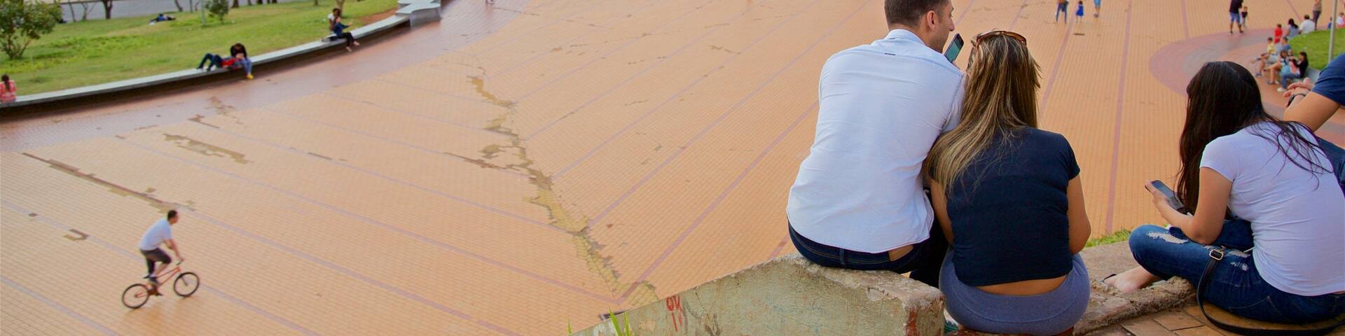 Pope\'s Square featuring a square or plaza and a sunset as well as a small group of people