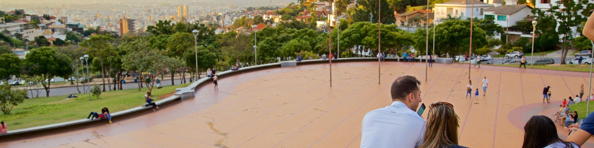 Pope\'s Square featuring a square or plaza and a sunset as well as a small group of people